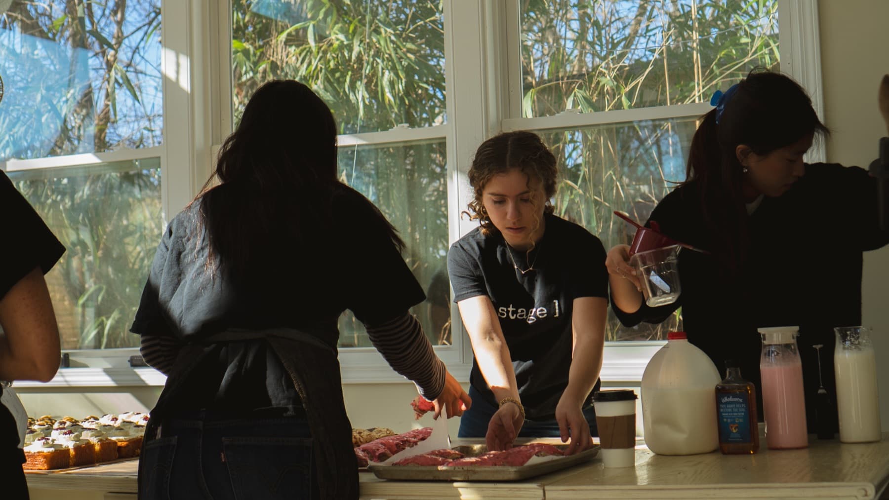 A chef plating by the window during the brunch pop-up
