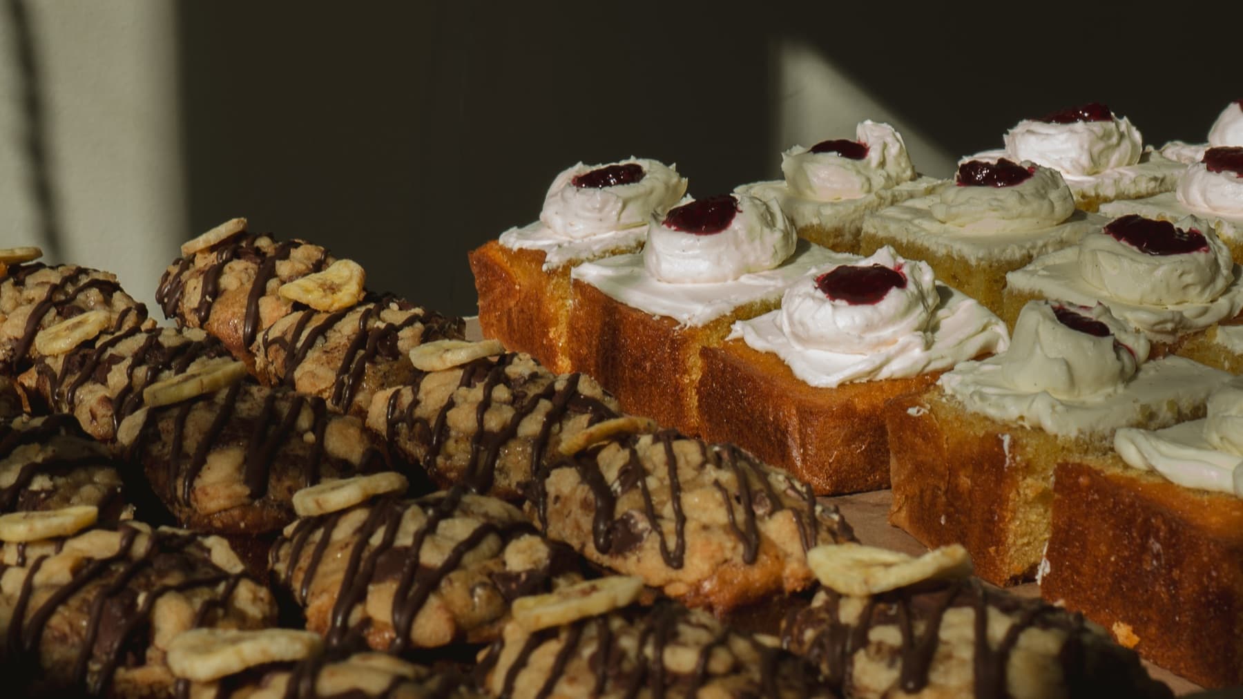 Cream and jam pastries on the pastry table