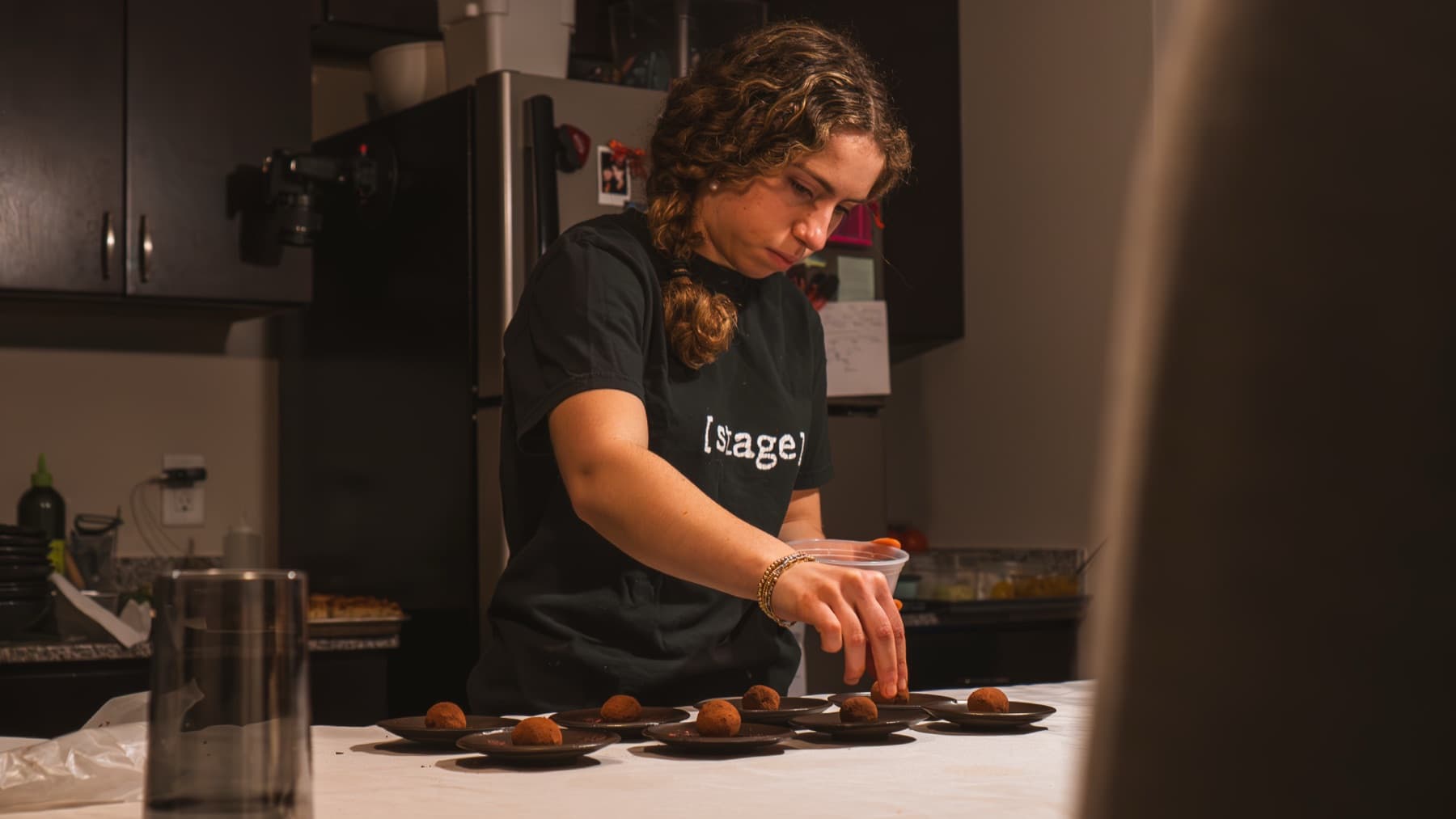 A chef plating during Dinner 1.0 service