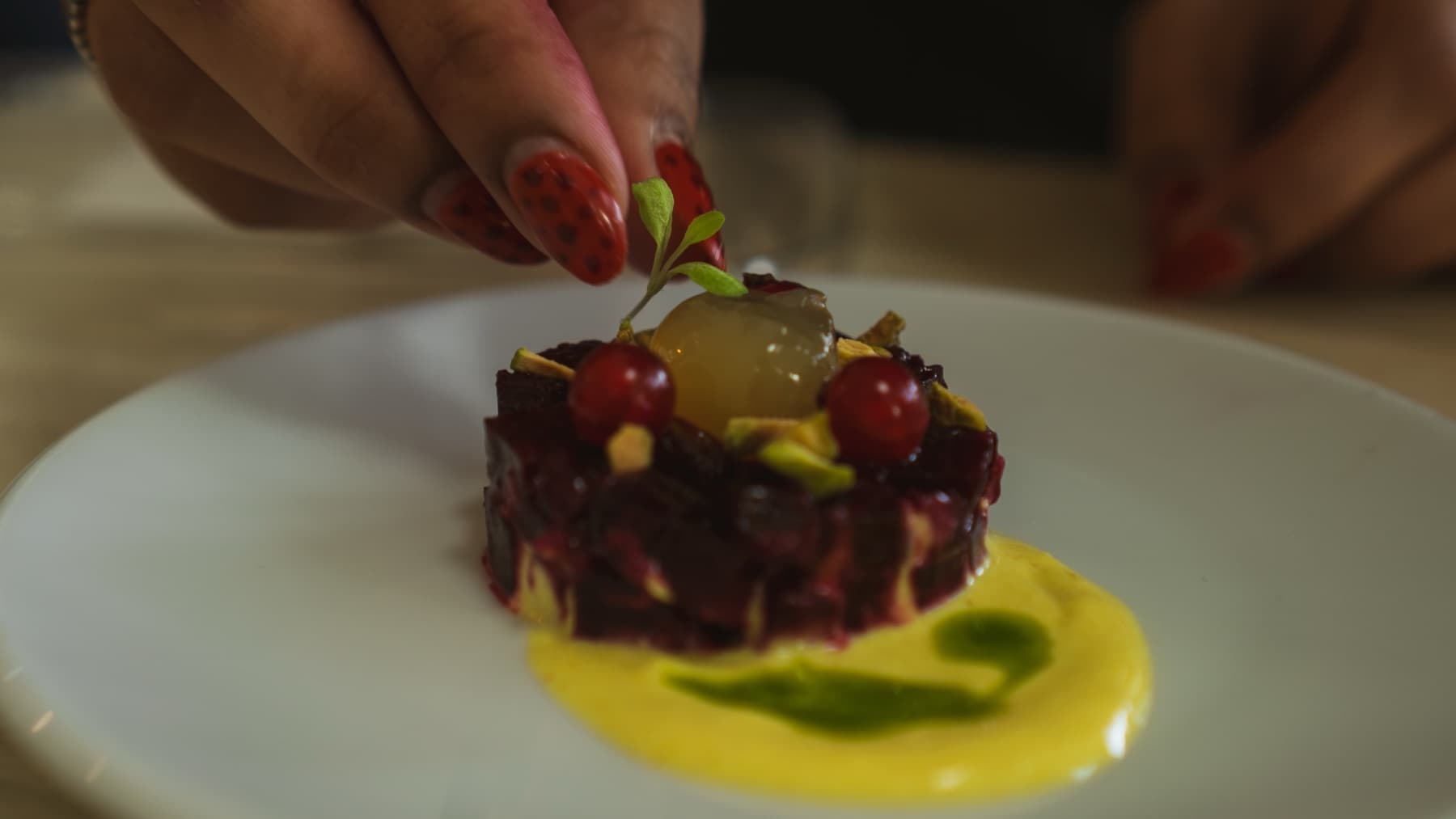 Plating grapes and pecans with tweezers