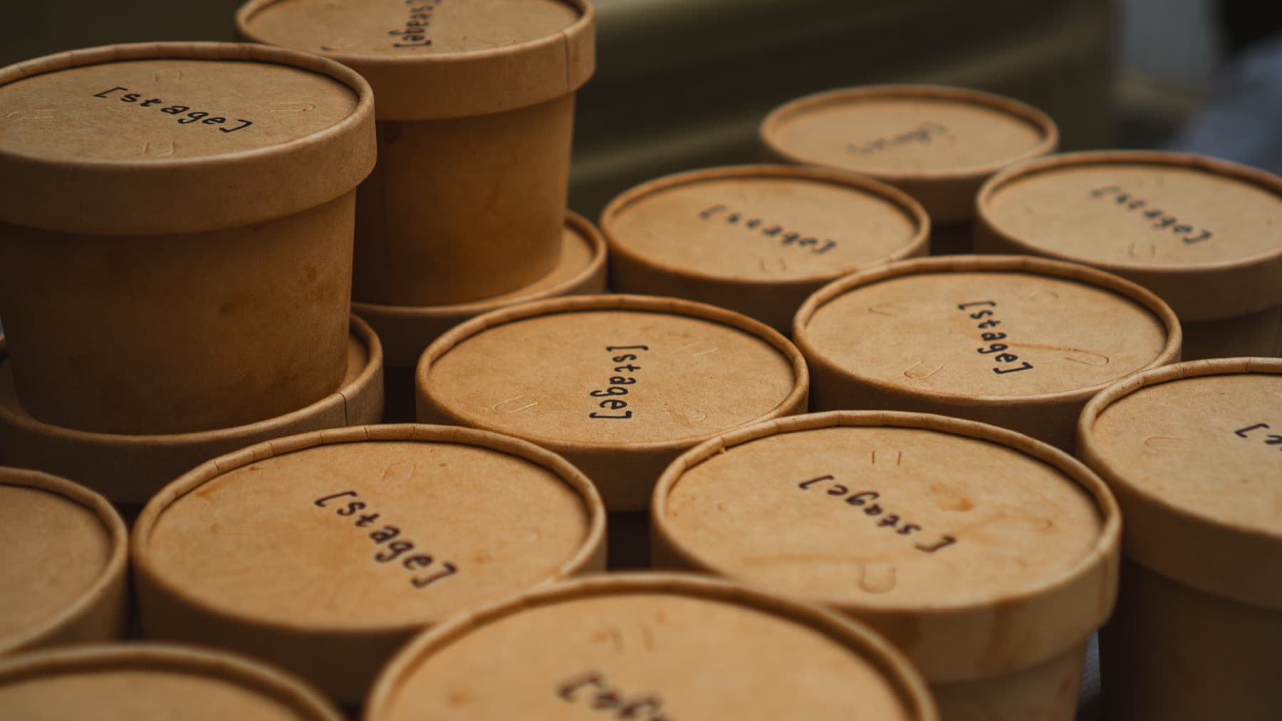 Cups stamped with the [ stage ] logo