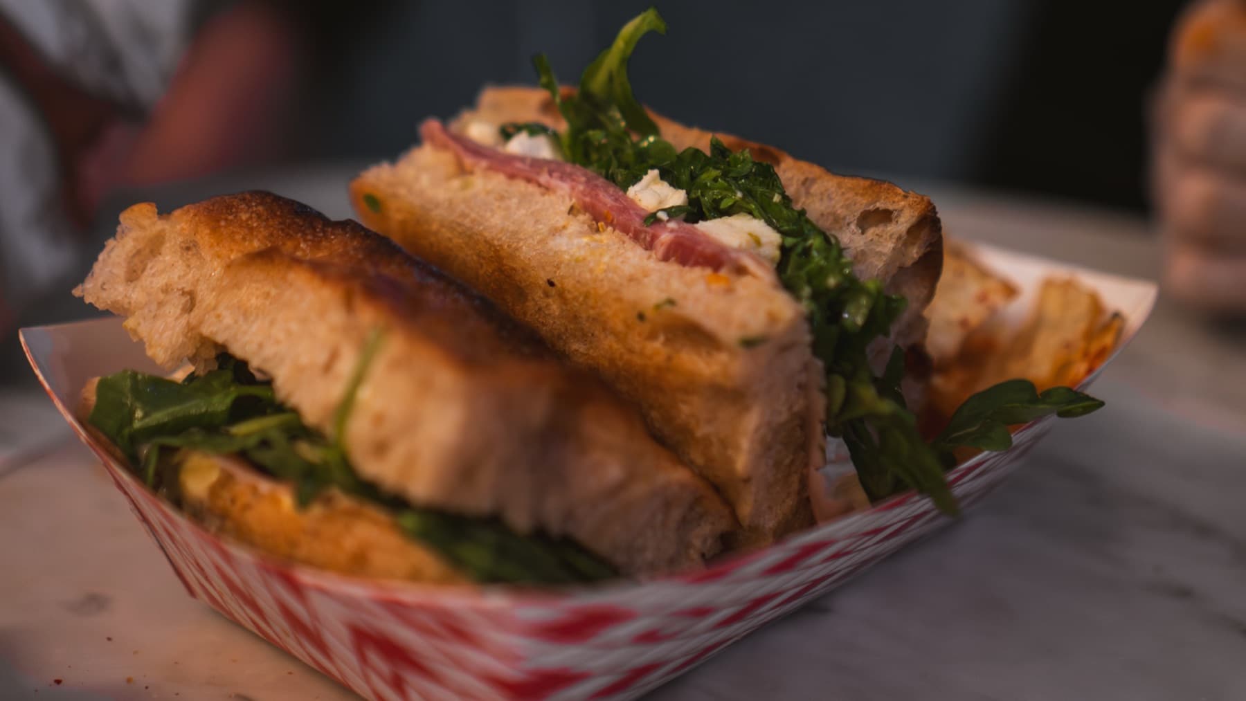 Focaccia sandwich plated with greens