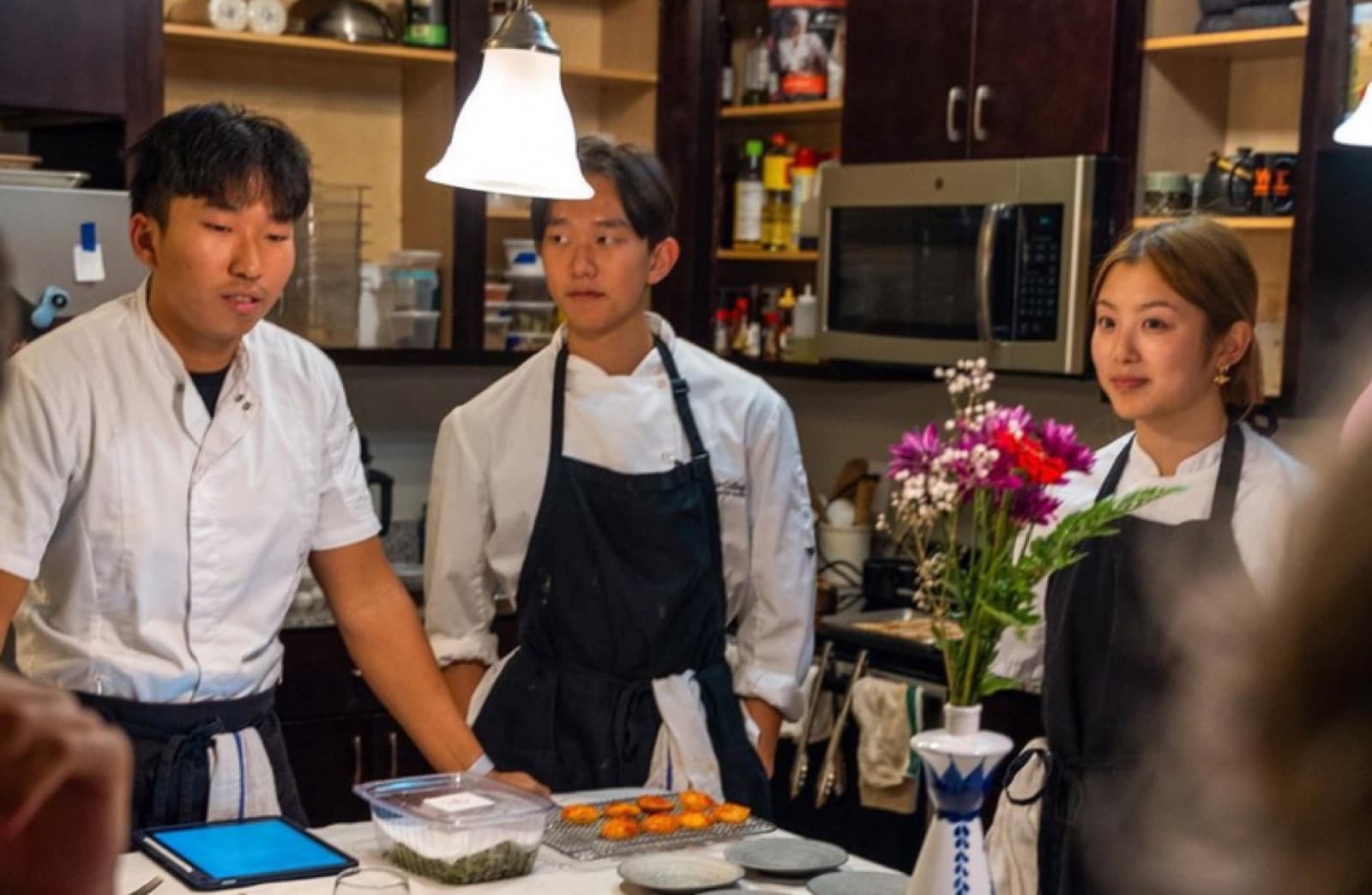 Chefs working the pass in the kitchen